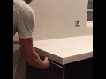 snapping the z counterform off our diy white concrete countertops.