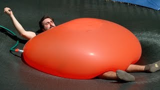 Crushed by a Giant 6ft Water Balloon - The Slow Mo Guys 4K