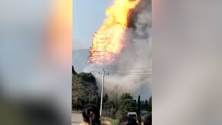 Asia's tallest wooden tower catches fire and collapses