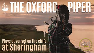 The Oxford Piper plays at sunset on Sheringham cliffs