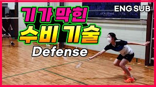 Badminton players practice defensive patterns