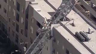 Crane collapses on Dallas apartment building, injuring some