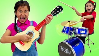 Jannie and Ellie Play with Music Toys and Instruments to Make a Rock Band | Kids Talent Show