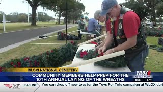Volunteers prep wreaths for veterans' graves at Biloxi National Cemetery