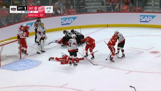 Larkin lies motionless on the ice, Perron gets ejected