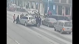 Footage: Passersby, motorists and vendors rescue boy trapped under SUV