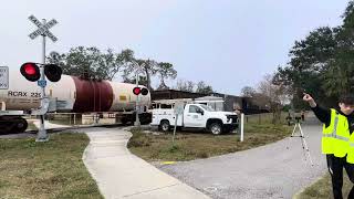 Csx l791 comes by a CSX maintenance truck