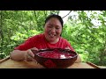 fat girl makes chopped pepper fish head steam on a clay stove for 10 minutesthe couple ate heartily