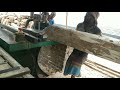 See how hard it is to cut down eucalyptus trees in the village sawmill.