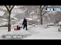 Heavy snow blankets parts of the Northeast, causing power outages and dangerous road conditions