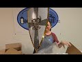 unboxing and conquering this pallet of amazing items. swords clothing medieval armor and more.