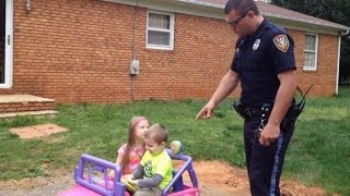 Police Officer Dad 'Pulls Over' Kids in Power Wheels, Gets Funny Reaction