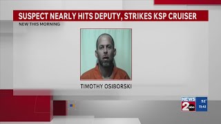 Suspect nearly hits deputy, strikes KSP cruiser