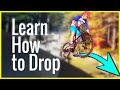 Learn How To Drop on a Mountain bike skill tutorial | Skills with Phil Learn How To Drop on a Mountain bike skill tutorial | Skills with Phil