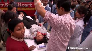 Nepal earthquake: buildings destroyed and injured treated a car