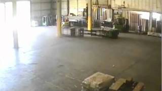 Fork lift truck topples over with worker in man cage www keepvid com