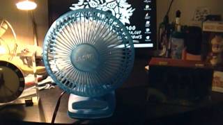 A Blue Lasko 6 Inch Desk Fan