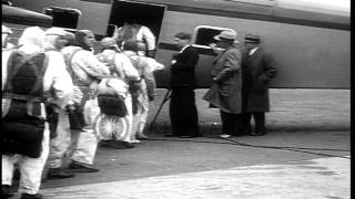 Parachutists jump from a US Curtis Condor aircraft over Roosevelt Field in Garden...HD Stock Footage