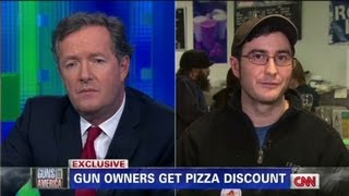 Pizza shop offers discounts for customers with guns