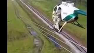 Helicopter Transfering Lineman to Wire 2014
