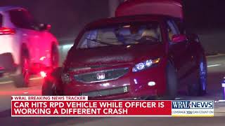 Car hits RPD vehicle while officer investigating different crash