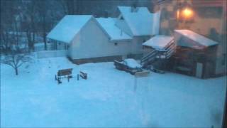 Snow sliding off metal roof