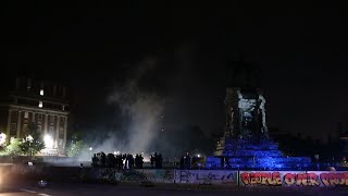 Protesters and police clash at Lee Monument on Friday night.