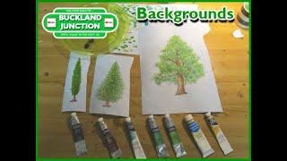 Painting watercolour trees to add to the Model Railway background at Buckland Junction, Alan in loft