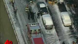 Raw Video: Bus Dangles Over Freeway After Crash