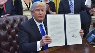 Travel ban leads to confusion and condemnation