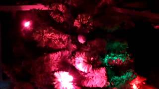 Flocked Christmas tree with flashing c7 lights