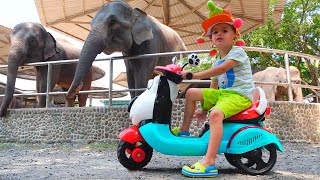 Vlad and Nikita riding bikes ride to the zoo