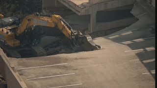 Crews demolish Terminal C parking garage at DFW Airport