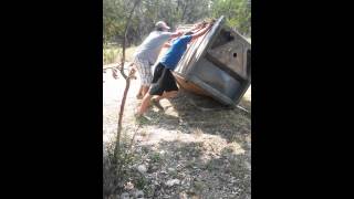 Man gets flipped in a porta potty with a bobcat