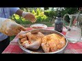 frying all two chickens under buckets in the village ~ an incredible dinner..