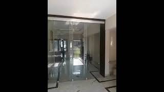 Frameless telescopic sliding glass partition