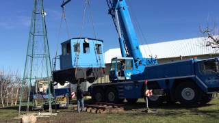 GE locomotive being craned in the air to it's new tracks