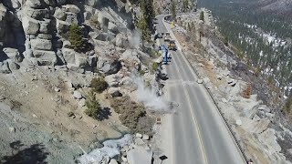 Drone footage: Caltrans crews scale boulders off US-50 at Echo Summit