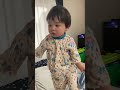 adorable baby wakes up brother