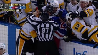 Malkin and Goodrow are going at it, when Matheson jumps in, and unknowingly face washes the linesman