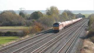 60085 passes cholsey manor farm footbridge with some murco tanks 07/11/2009