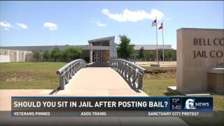 Should you sit in jail after posting bail?