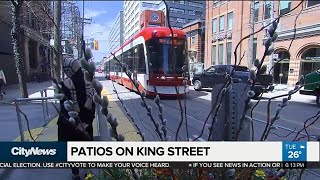 City building patios on King Street to attract people