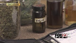 VIDEO: Muskogee County couple arrested after deputies find drugs, guns sitting next to young childre