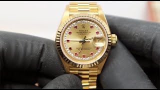 (PRE-OWNED) Rolex Ladies Date Just President 18KT 69178 Champagne Sunburst Rubies String Diamonds