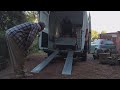 unloading a tracked beach tractor