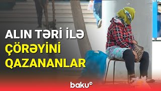 Qızmar günəş altında çalışan sakinlər