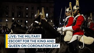 Live – The military escort for the King and Queen on Coronation Day.