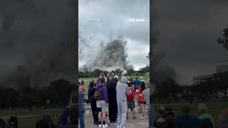 Spectators watch controlled building implosion in Louisiana