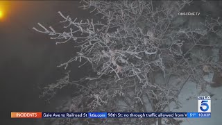 Officials warn of dangerous driving conditions as snow falls along Grapevine